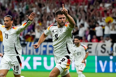 Niclas Fuellkrug celebrates scoring his side's first goal